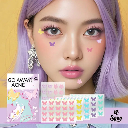 Person with butterfly stickers on face and packaging labeled 'GO AWAY! ACNE' by Soug on a yellow background