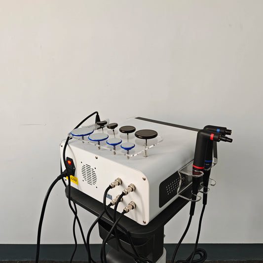 Medical device with various attachments on a gray background